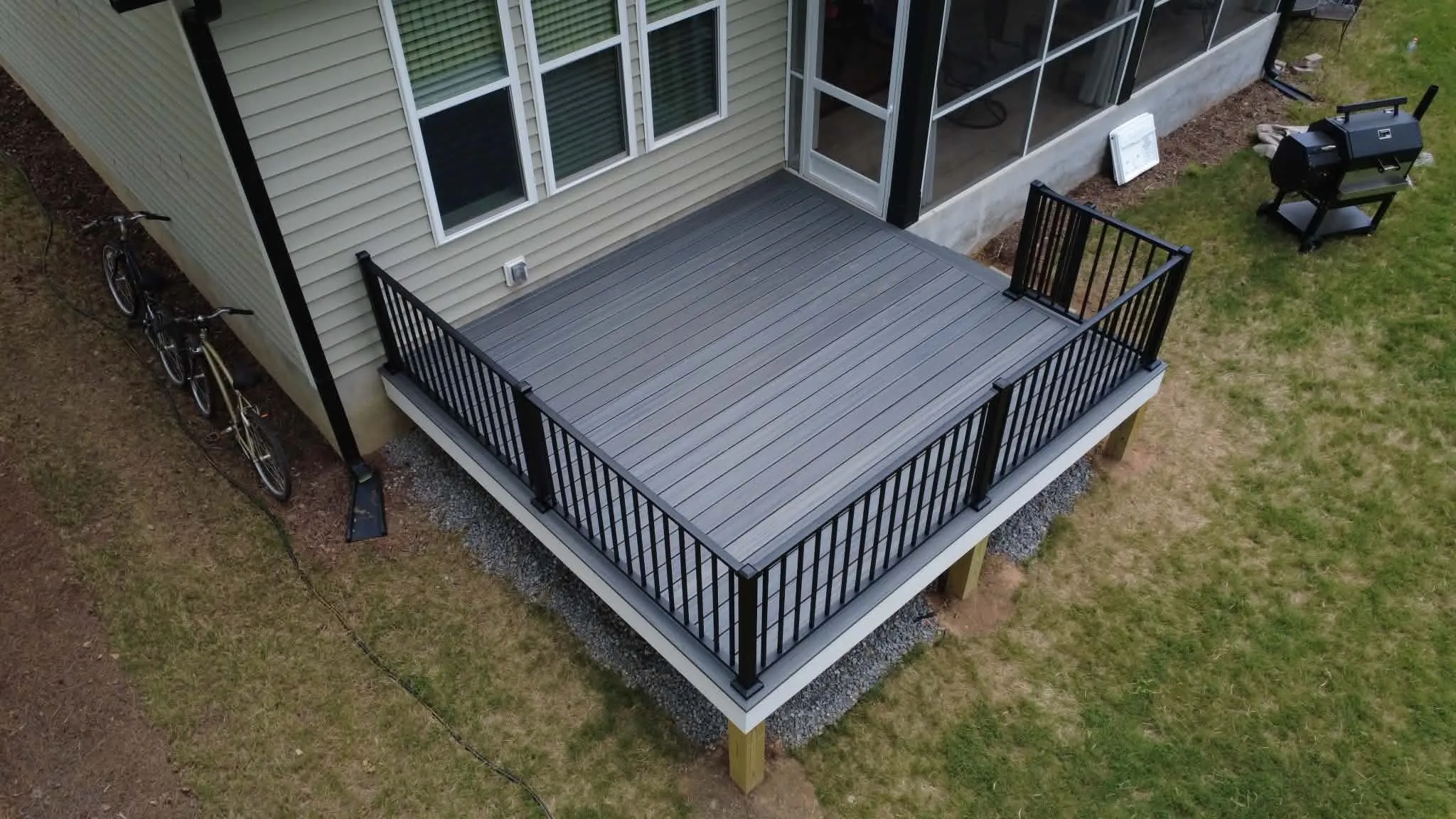Gray composite deck with black metal railing