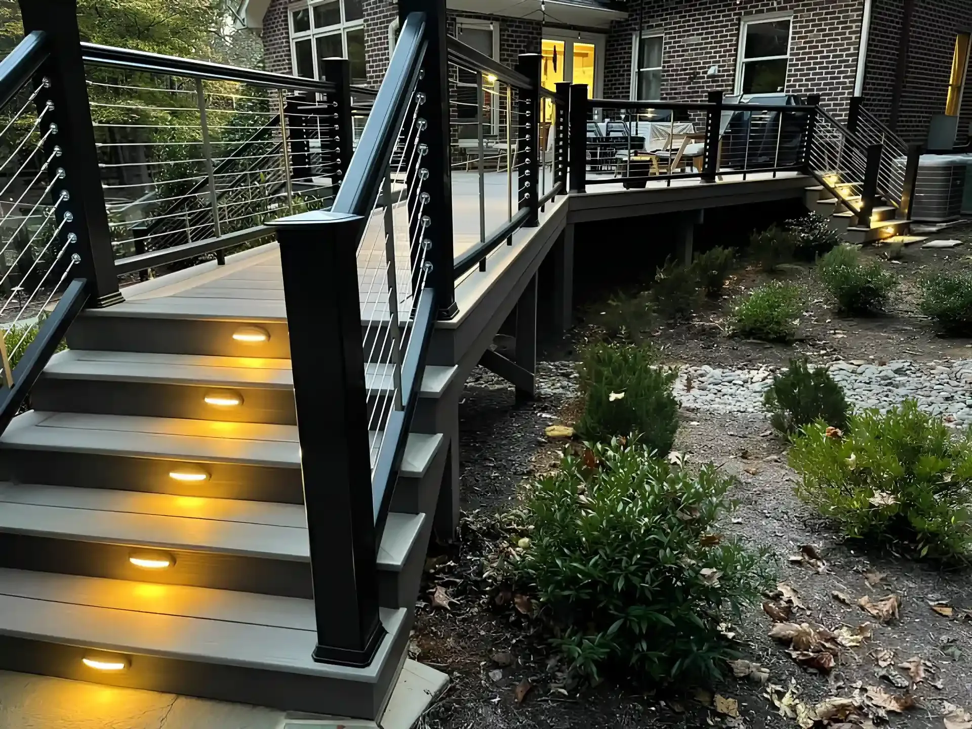 Lit stair risers and rail posts on a deck