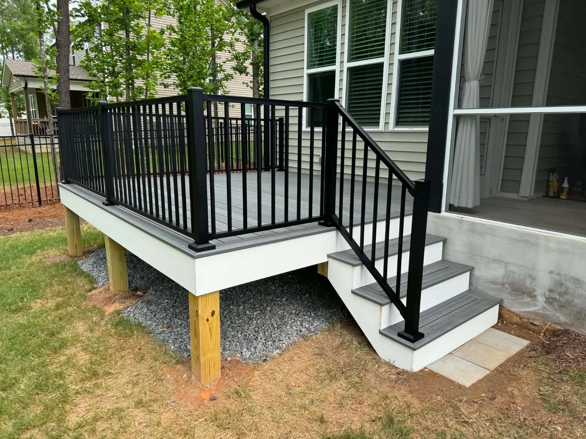 Black metal deck guards and a short stair flight