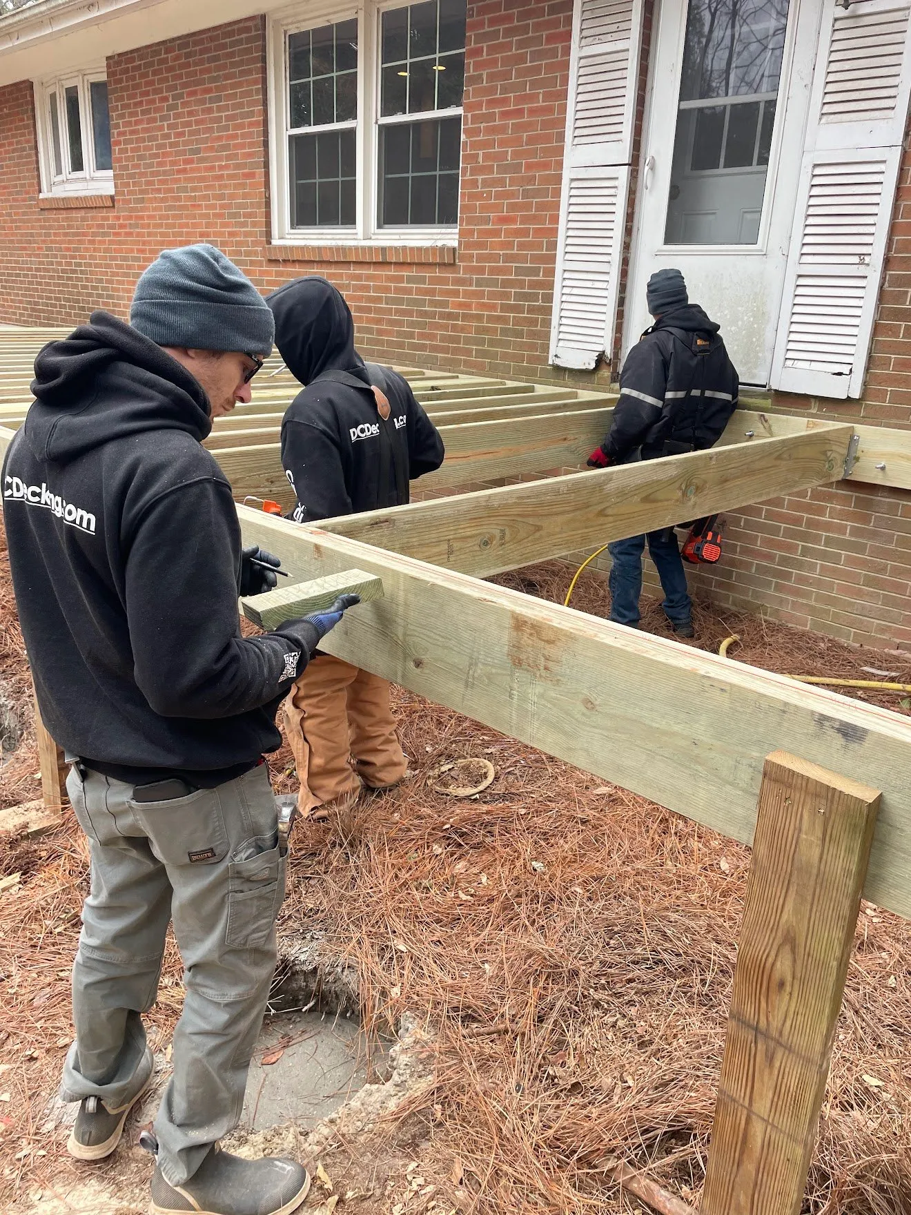 Crew working on deck framing
